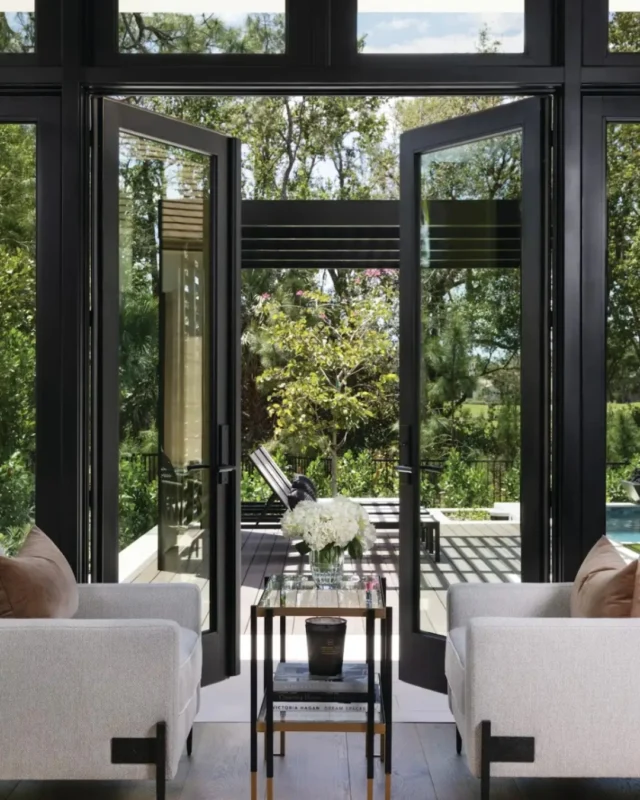 The precision of these black doors against natural wood flooring creates an exquisite frame, perfectly connecting luxurious interiors with serene outdoor living.🖤🌳

#LuxuryLiving #ArchitecturalDetails #BlackDoors #WoodFloors #OutdoorViews #DiamondCustomHomes #DreamHome
